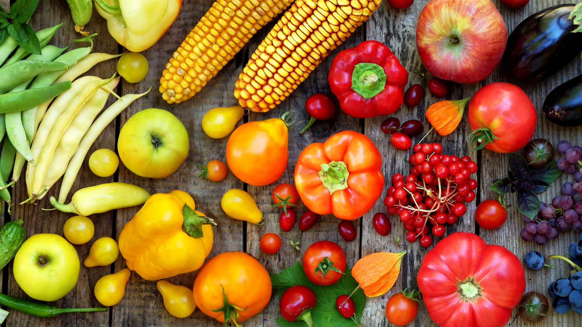 Image of fruits and vegetables on a wood deck.