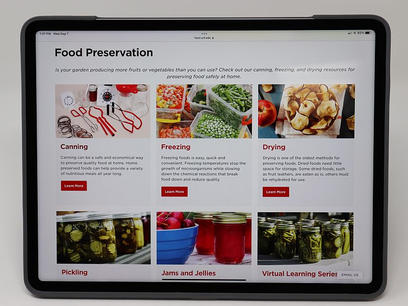 An iPad with the NE state food preservation webpage displayed.