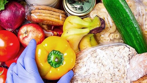 Image of fruits, vegetables, oats, pasta, a canning jar, and a gloved hand holding a yellow pepper.