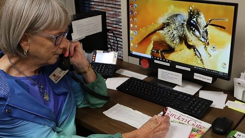 Woman talking on a phone.